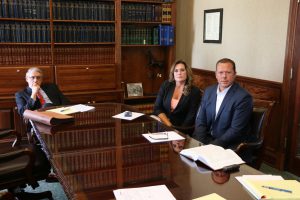 From left: John Biscoe, county administrator; Lapeer County Treasurer Dana Miller, and John Miller, former chief assistant prosecuting attorney. Photo by Andrew Dietderich