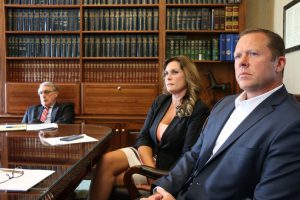 From left: John Biscoe, county administrator; Lapeer County Treasurer Dana Miller, and John Miller, former chief assistant prosecuting attorney. Photo by Andrew Dietderich