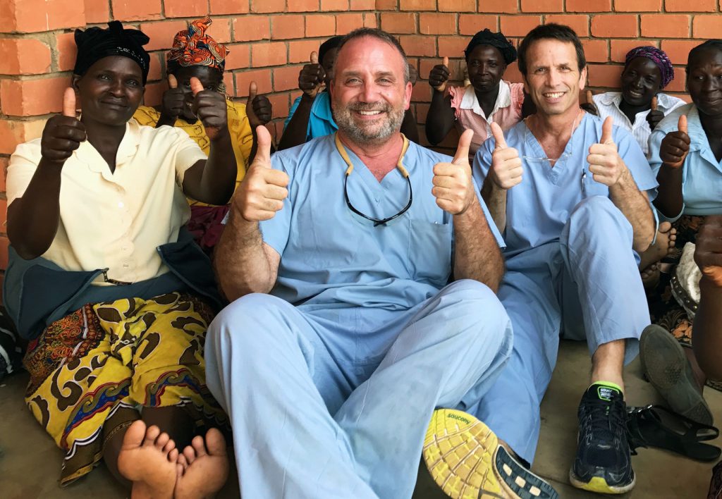 Kenneth Peters, M.D. (center) has been leading a mission to Africa for 13 years, with the last 10 going to Zambia.